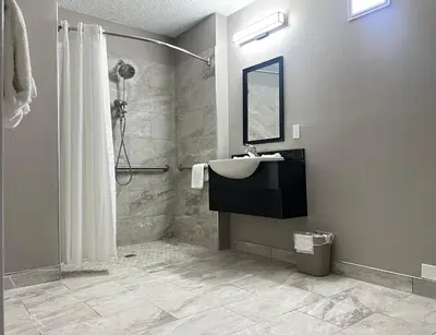 a bathroom with a sink and a shower at Motel 6-Middleburg Heights, OH - Cleveland in Middleburg Heights