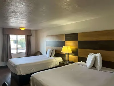 a hotel room with two beds and a window at Motel 6 Cross Lanes, WV Goff Mountain Rd in Cross Lanes