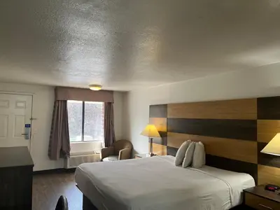 a hotel room with a bed and a window at Motel 6 Cross Lanes, WV Goff Mountain Rd in Cross Lanes
