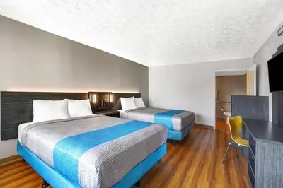 a hotel room with two beds and a television at Motel 6 Lexington I-75 Hamburg in Lexington