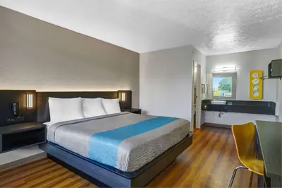 a hotel room with a bed and a desk at Motel 6 Lexington I-75 Hamburg in Lexington