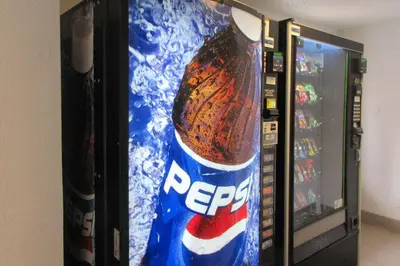 a vending machine with a large bottle of pepsi at Rodeway Inn Washington PA in Washington