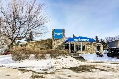 a watsonine store with a blue awning in the snow at Rodeway Inn Washington PA in Washington