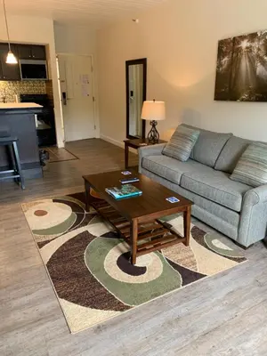 a living room with a couch and a coffee table at McCoy's Inn in Ripley