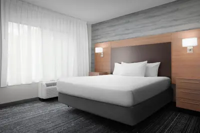 a hotel room with a bed and a window at TownePlace Suites Bridgeport Clarksburg in Bridgeport