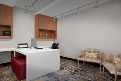 an office with a white desk and two chairs at TownePlace Suites Bridgeport Clarksburg in Bridgeport