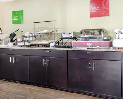 a kitchen with a counter with some food on it at Comfort Inn Winchester in Winchester