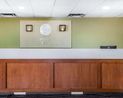 a counter in a room with a sign on the wall at Comfort Inn Winchester in Winchester