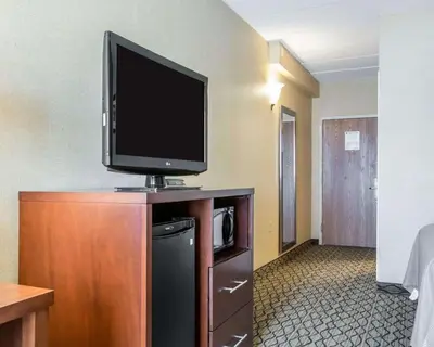 a flat screen tv sitting on top of a dresser at Comfort Inn Winchester in Winchester
