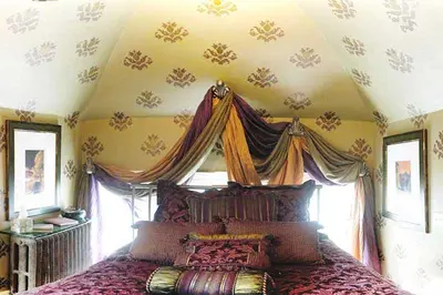a bedroom with a large bed with a canopy at Gaslight Bed & Breakfast in Cincinnati