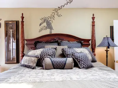 a bedroom with a bed with pillows on it at Gaslight Bed & Breakfast in Cincinnati