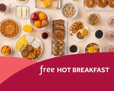 a table filled with different types of breakfast foods at Drury Inn & Suites Cincinnati Northeast Mason in Mason