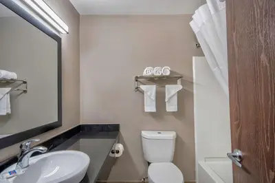a bathroom with a white toilet and a sink at Motel 6 - Georgetown, KY - Lexington North in Georgetown