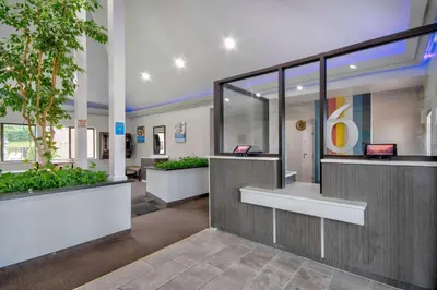 a lobby of a hospital with two computers in it at Motel 6 - Georgetown, KY - Lexington North in Georgetown