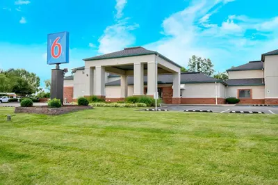 a gas station with a sign in the grass at Motel 6 - Georgetown, KY - Lexington North in Georgetown
