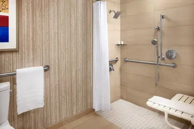 a bathroom with a shower and a toilet at The Westin Cincinnati in Cincinnati
