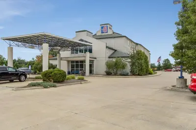a building with a parking lot in front of it at Motel 6-Medina, OH - Cleveland in Medina