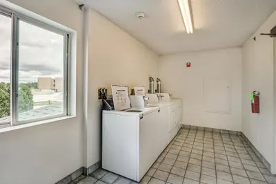 a kitchen with a refrigerator and a window at Motel 6-Medina, OH - Cleveland in Medina