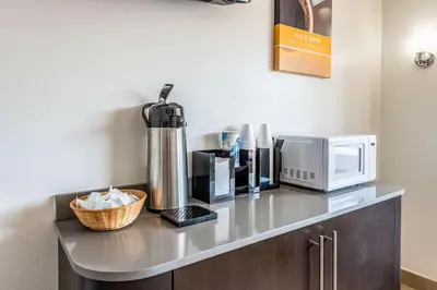 a counter with a microwave and a coffee maker on it at Motel 6-Mansfield, OH in Mansfield