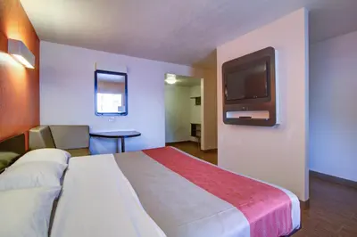 a hotel room with a large bed and a tv at Motel 6-Richfield, OH in Richfield