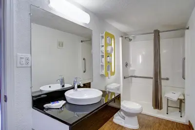 a white bathroom with a sink and a toilet at Motel 6-Richfield, OH in Richfield