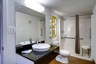 a white bathroom with a sink and a toilet at Motel 6-Richfield, OH in Richfield