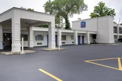 a large white building with a parking lot at Motel 6-Richfield, OH in Richfield