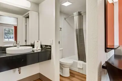 a bathroom with a toilet sink and a shower at Motel 6-Youngstown, OH in Youngstown