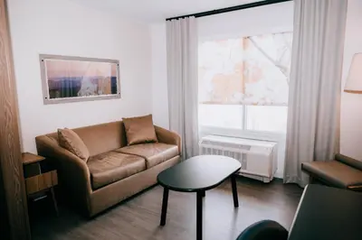 a living room with a couch and a table at Fairfield by Marriott Inn & Suites Georgetown Lexington in Georgetown