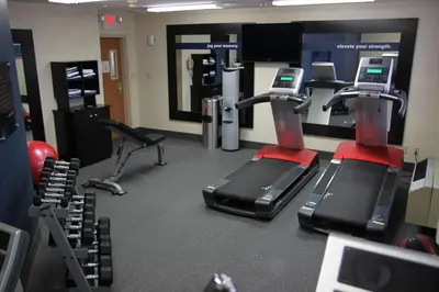 a gym with two treadmills and exercise machines at Hampton Inn & Suites Chillicothe in Chillicothe