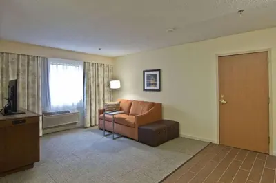 a living room with a couch and a television at Hampton Inn & Suites Chillicothe in Chillicothe