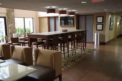 a dining room with a large table and chairs at Hampton Inn & Suites Chillicothe in Chillicothe