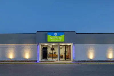 a supermarket with a sign on the front of it at SureStay by Best Western Greenville in Greenville
