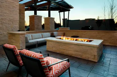 a patio with a couch and a fire pit at SpringHill Suites by Marriott Columbus Easton Area in Columbus