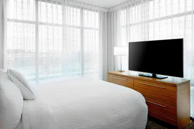 a bedroom with a bed and a flat screen tv at TownePlace Suites by Marriott Columbus Easton Area in Columbus