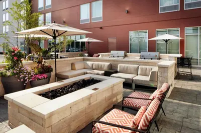 a patio with a bar with couches and a table at TownePlace Suites by Marriott Columbus Easton Area in Columbus