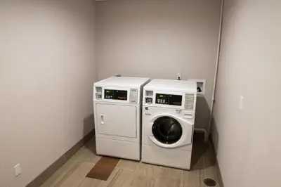 a washing machine and a washer in a room at Holiday Inn Express & Suites - Dayton Southwest by IHG in Dayton