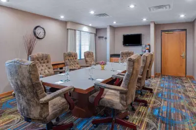 a conference room with a table and chairs at Wingate by Wyndham Lima in Lima