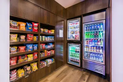 a room with a refrigerator filled with lots of drinks at Fairfield by Marriott Inn & Suites Dayton Downtown in Dayton