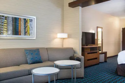 a living room with a couch and two tables at Fairfield by Marriott Inn & Suites Dayton Downtown in Dayton