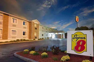 a super sign in front of a building at Super 8 by Wyndham Lexington Hamburg Area in Lexington