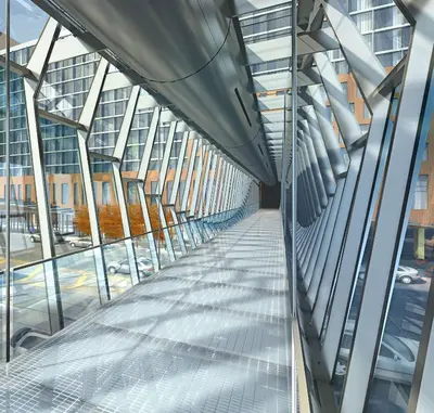 a glass walkway in a building with a view of a street at Hilton Columbus Downtown in Columbus