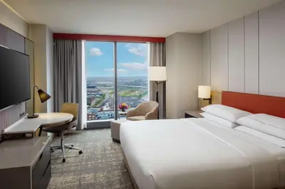 a hotel room with a large bed and a large window at Hilton Columbus Downtown in Columbus
