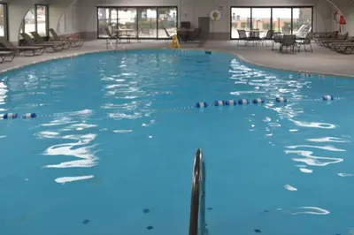 a large swimming pool with blue water at Quality Inn Perrysburg - Toledo South in Perrysburg