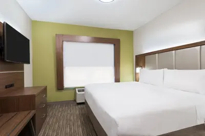 a hotel room with a bed and a television at Holiday Inn Express & Suites - Columbus Airport East by IHG in Columbus