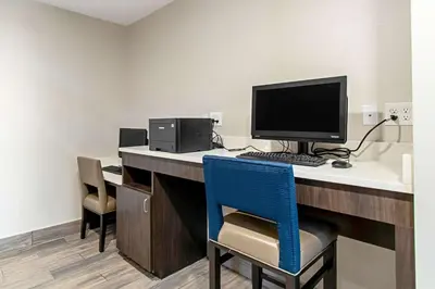 an office with a desk with a computer on it at Comfort Suites Grove City - Columbus South in Grove City