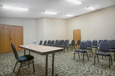 a conference room with a table and chairs in it at Ramada by Wyndham Columbus North in Westerville