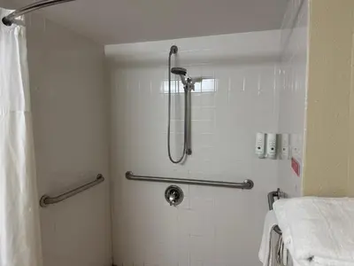 a shower in a bathroom with a shower curtain at Quality Inn & Suites Middletown - Franklin in Franklin