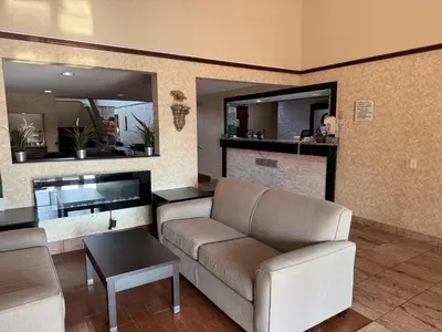 a living room with a couch and a table at Quality Inn & Suites Middletown - Franklin in Franklin