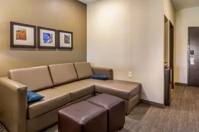 a living room with a couch in a waiting room at Comfort Suites Brunswick Town Center in Brunswick